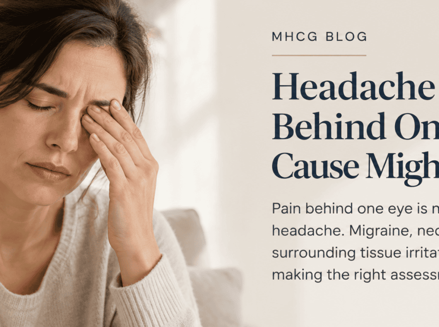 Woman experiencing a headache behind one eye, illustrating possible migraine or neck-related headache causes.